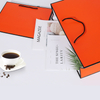 Foldable Cheap Aqueous Coating Bulk Shopping Orange Paper Bag with Black Line Rope Handle Manufacturer Wholesale